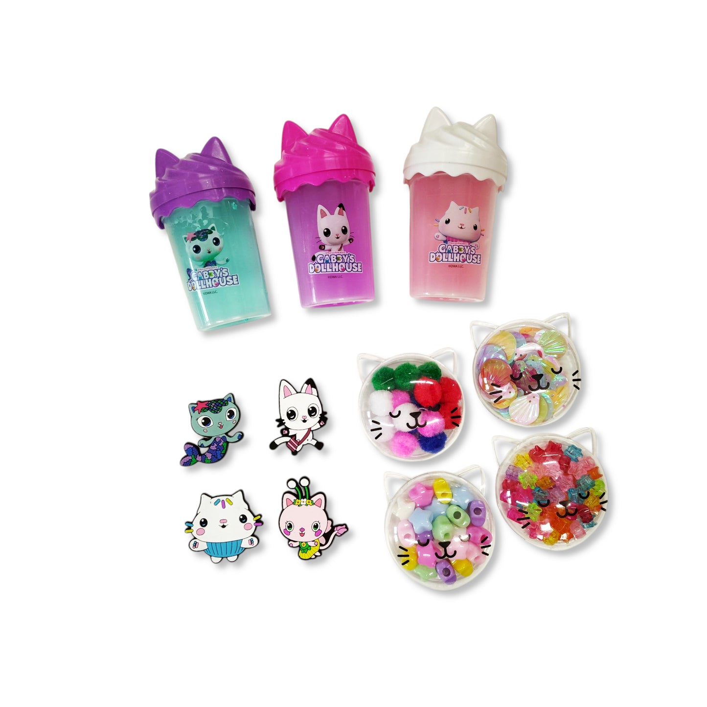 Interior of Gabby's Dollhouse Slime Mix-It Set showing 3 slime tubs, 4 confetti pots, and character charms ready for mixing and play