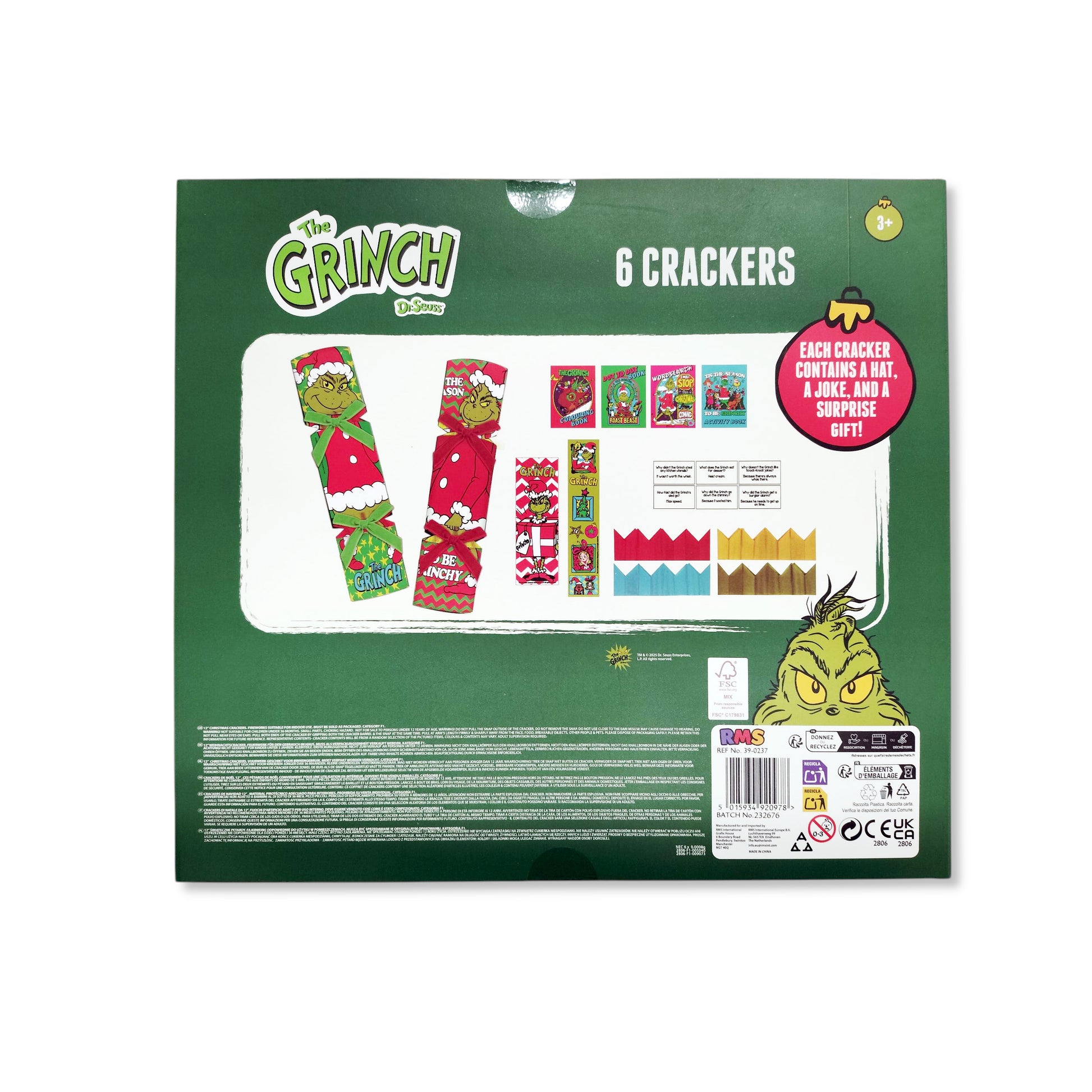 Close-up of Grinch cracker contents including hat, joke and surprise gift